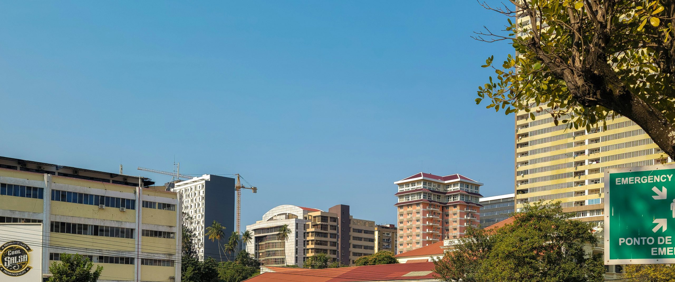 a street sign in a city with buildings in the background